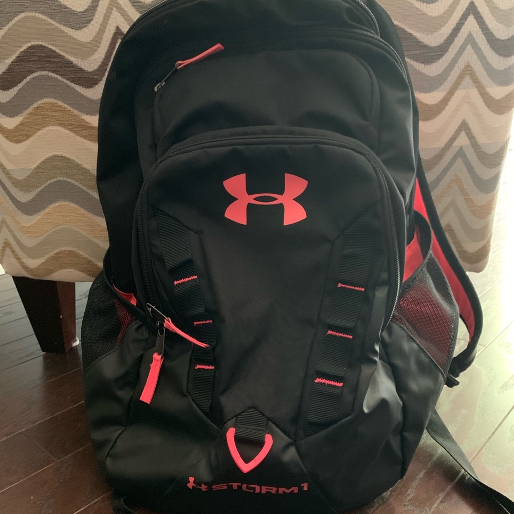 Pink and black Storm Under Armour backpack